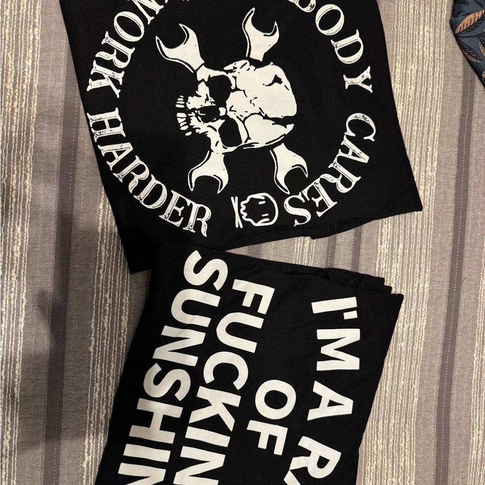 Black Graphic T-Shirt with Bold White black logo. Fits small.